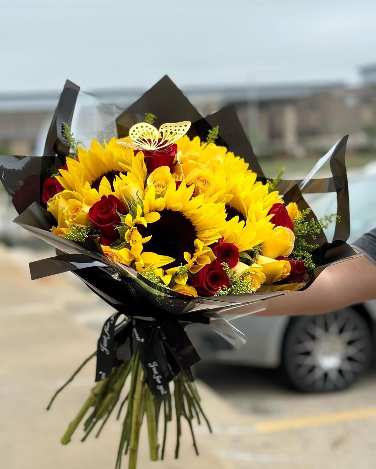 roses and sunflowers wrapped in paper